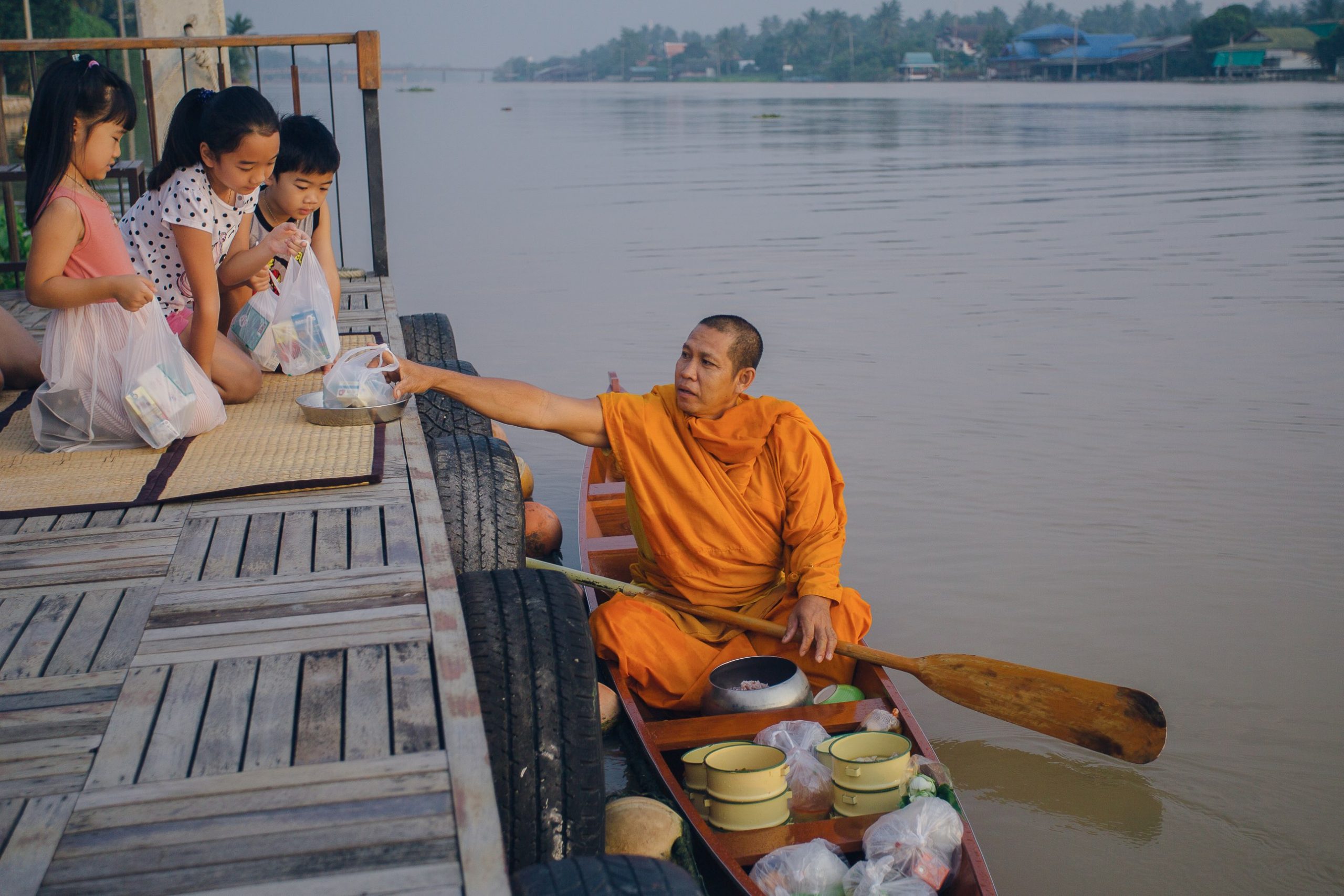 monk will paddle a boat for merit making